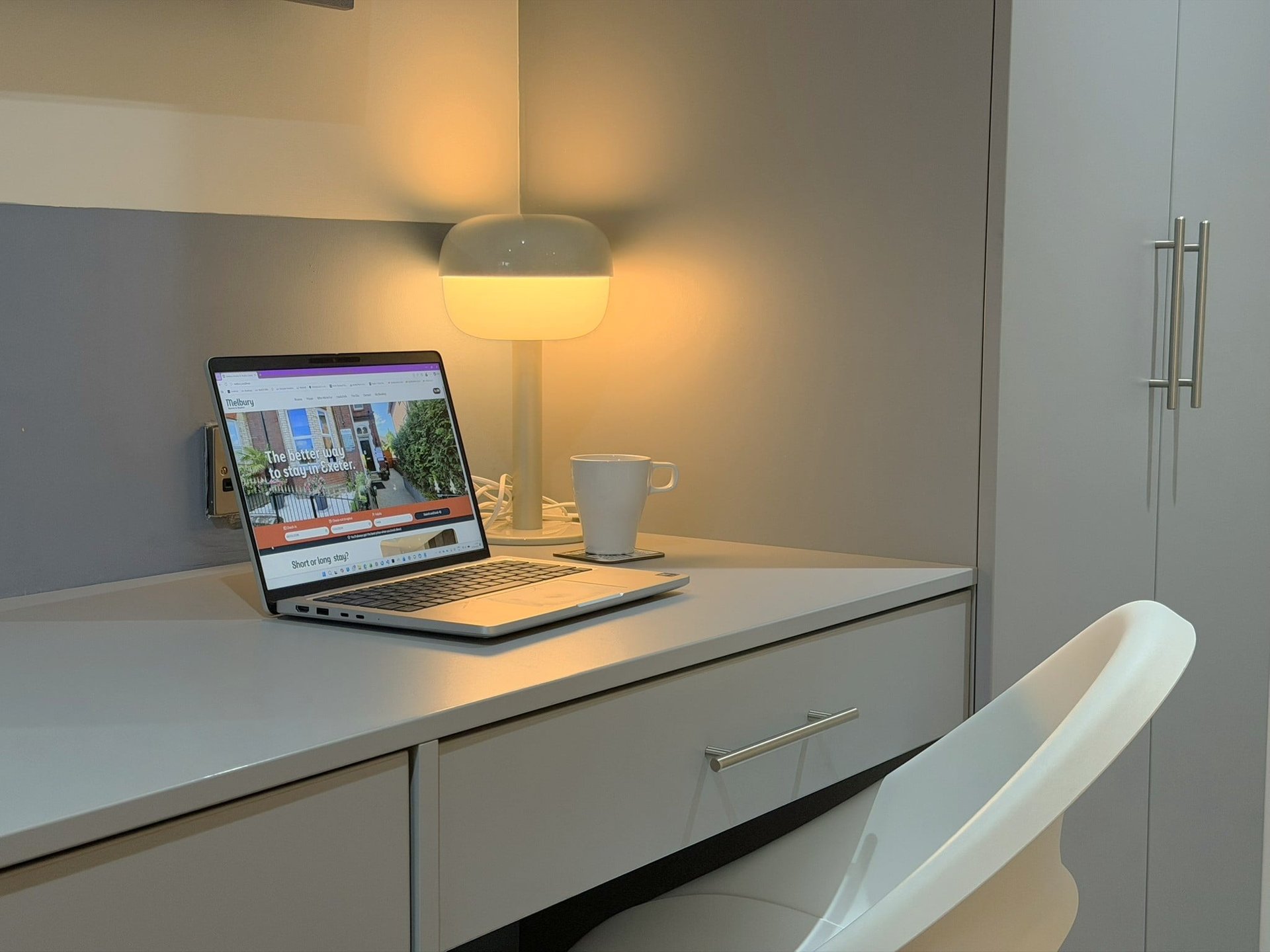 A desk with a laptop in a Melbury studio