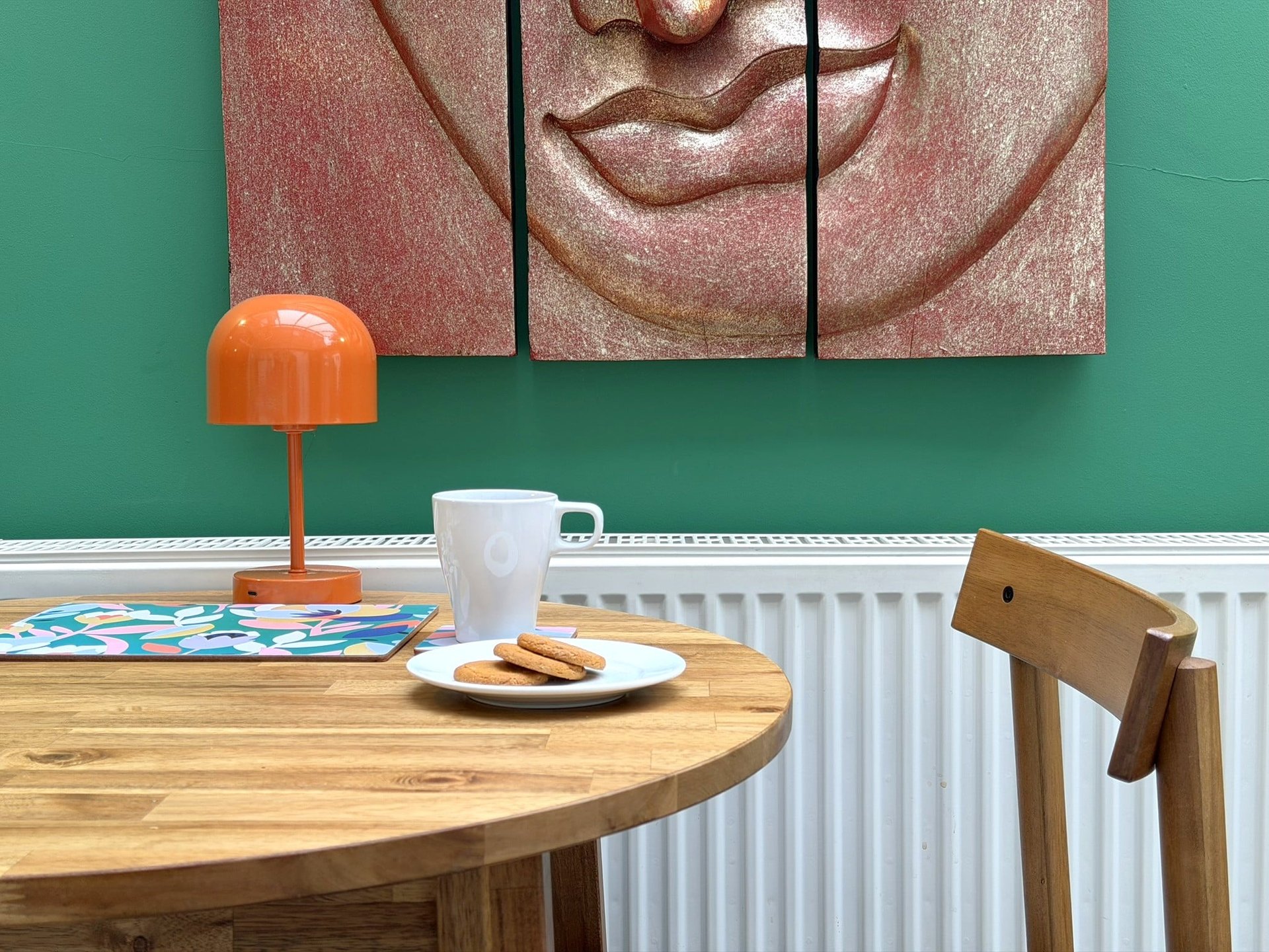 Dining table with mug and a plate of biscuits