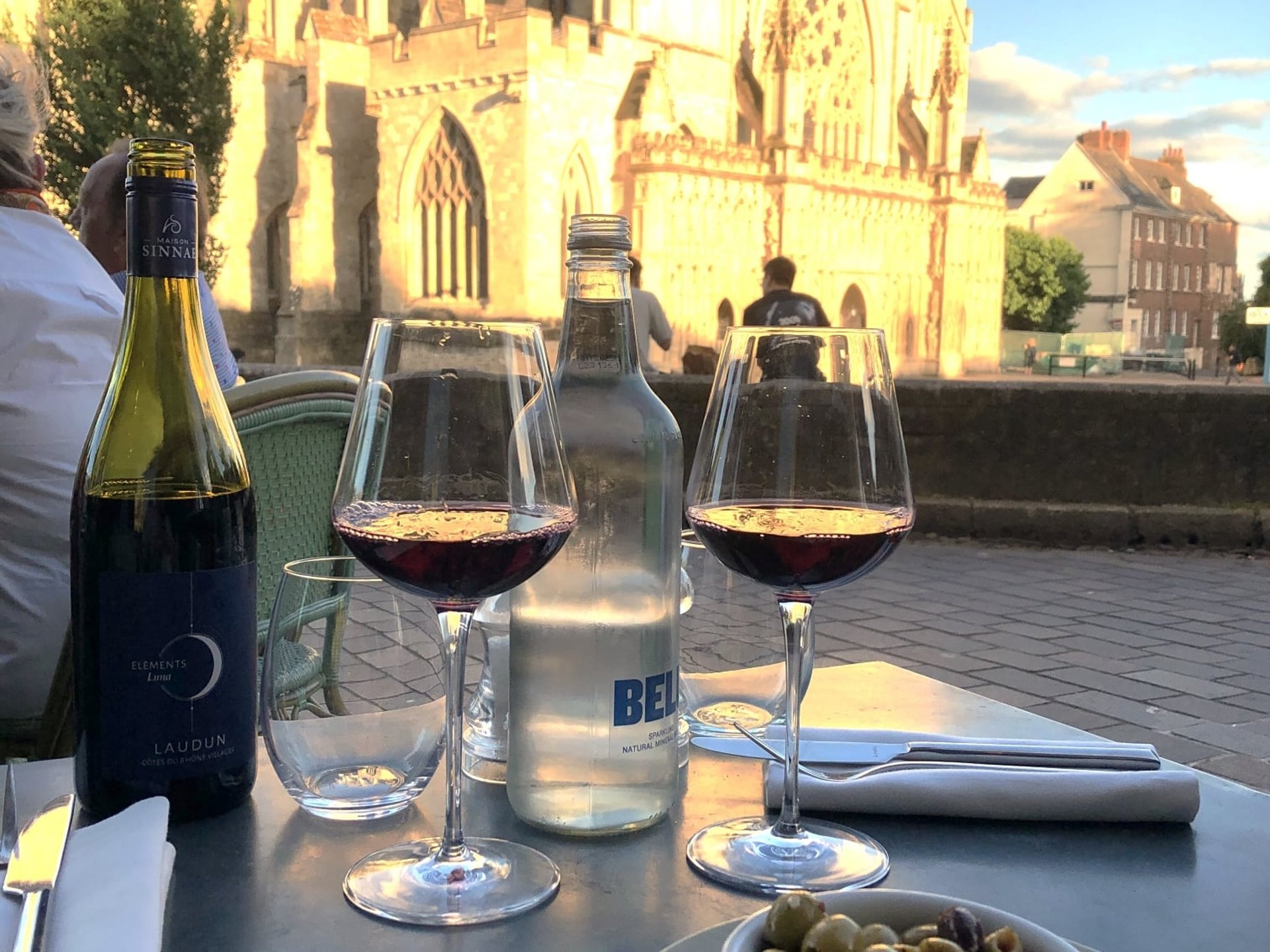 Glasses of wine on a restaurant table by Exeter Cathedral